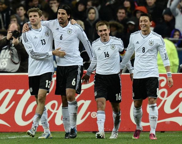Germany's midfielder Sami Khedira (C) celebrates with Germany's midfielder Thomas Mueller after scoring against France
